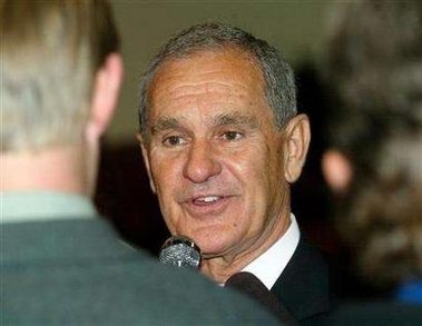 PetroKazakhstan chief executive Bernard Isautier smiles while being interviewed after shareholders' approval to sell the company to China State Oil at a meeting in Calgary October 18, 2005. 