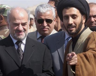 Iraqi Prime Minister Ibrahim al-Jaafari, left, listens to a Shiite cleric, name not available, right, during a visit to Basra, Iraq, Sunday Oct. 23 2005. A government spokesman indicated Sunday that the government would accept the Arab League's proposal for a dialogue conference aimed at bringing Sunni Arabs into a political process they feel has marginalized them.(AP