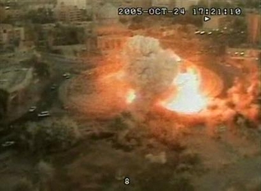 An image taken from a security camera shows an explosion on the roundabout outside the cement wall surrounding the Palestine Hotel compound, bottom right, in Baghdad, Iraq, Monday, Oct. 24, 2005. 