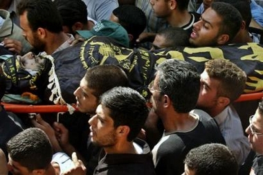 Palestinian mourners carry the body of top Islamic Jihad militant Luay Saadi during his funeral in the West Bank town of Tulkarem, Tuesday, Oct. 25, 2005.