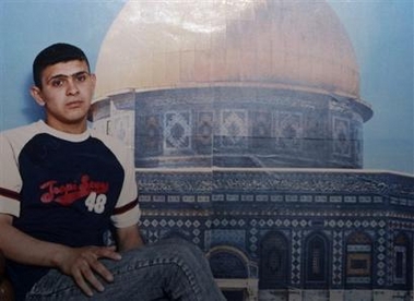 This is an undated picture of 20-year-old son Hassan Abu Zeid, with the background of a picture of the Dome of the Rock, one of Islam's shrines built on the Temple Mount, in Jerusalem, taken from the family album from his house in the West Bank town of Qabatiyeh Wednesday Oct. 26, 2005.