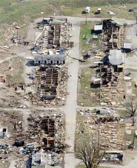 Debris from Ellis Park litters the area in the aftermath of a tornado in Henderson, Ky., Sunday, Nov. 6, 2005. The tornado ripped across southwestern Indiana and northern Kentucky, killing at least 20 people, wrecking homes and knocking out power to thousands, authorities said. (AP 