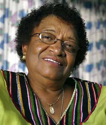 Former Liberian finance minister Ellen Johnson-Sirleaf smiles at her home in Monrovia as she claimed victory November 10, 2005 in Liberia's presidential run-off and looked set to become Africa's first elected female head of state. Announcing what seemed an unbeatable lead for the Harvard-educated banker, the National Elections Commission said that with ballots tallied from nearly 90 percent of polling stations, Johnson-Sirleaf had 59.2 percent of the votes from Tuesday's election.