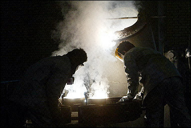 Two Iranians work at the zirconium production plant, part of the nuclear facilities in Isfahan.