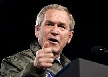 U.S. President George W. Bush speaks to troops at Elmendorf Air Force Base in Anchorage, Alaska, on a stop enroute to Asia November 14, 2005.