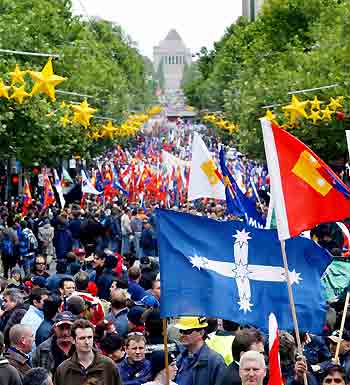 Australian workers march through Swanston Street during a demonstration against the federal government's proposed industrial relations changes in Melbourne November 15, 2005. Some 100,000 people marched in state capitals during a national day of protest against the proposed workplace changes, local media said.