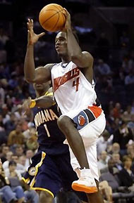 Charlotte Bobcats' Kareem Rush (4) drives to the basket past Indiana Pacers' Stephen Jackson during the second half on Wednesday, Nov. 16, 2005 in Charlotte, N.C.
