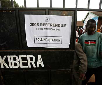 A Kenyan man leaves a polling station after voting in Kibera, Nairobi's largest slum November 21, 2005. Kenyans voted on Monday in a referendum on a new constitution amid fears violence could mar a vote seen as a dress rehearsal for the east African nation's 2007 election.