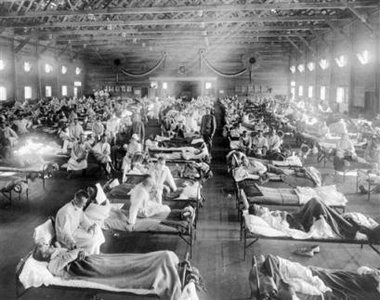 In this 1918 file photograph, influenza victims crowd into an emergency hospital at Camp Funston, a subdivision of Fort Riley in Kansas. The flu, which is believed to have originated in Kansas, killed at least 20 million people worldwide
