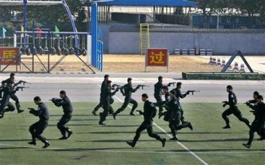 Chinese police and special forces take part in a security exercise at a special force training base in the south of the city of Beijing, China, Friday, Nov. 25, 2005. 