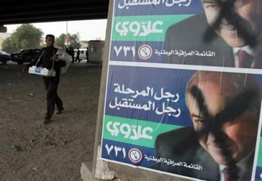 A man walks past defaced electoral posters of former Iraqi prime minister Ayad Allawi reading, 'Allawi the man for this stage, the man of the future. Iraqi National Iraqi list', referring to his electoral list for the Dec. 15 parliamentary elections, in Baghdad, Iraq, Monday, Nov. 21, 2005. (AP