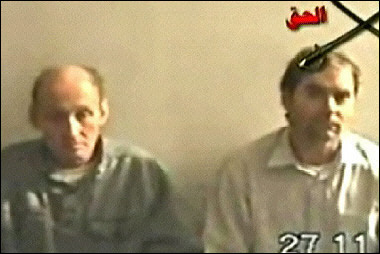 A video grab taken from Al-Jazeera television shows two of the four foreigners taken hostage in Iraq.
