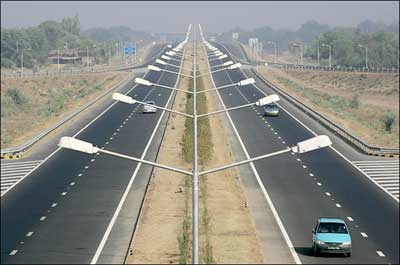 The new national highway in Rajasthan State, India. The revamped highways are feeding a new appetitie for fast cars.