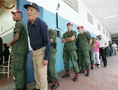 Venezuelan soldiers 
 and civilians line up to vote at a poll station in Caracas, Venezuela, Sunday, Dec. 4, 2005.