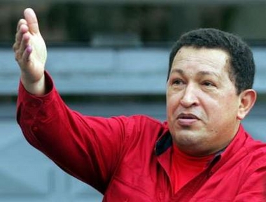 Venezuelan President Hugo Chavez greets supporters after casting his ballot during legislative elections in Caracas, December 4, 2005. 