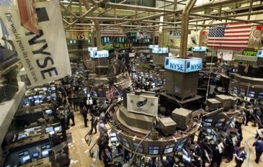 Traders work on the floor of the main room of the New York Stock Exchange, Tuesday Dec. 6, 2005.