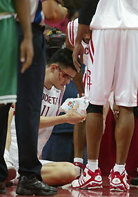 ouston Rockets center Yao Ming bleeds after being hit in the right eye by the elbow of Boston Celtics forward Brian Scalabrine in the second half of their NBA game in Houston December 6, 2005.