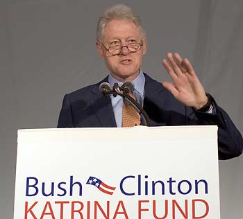 Former U.S. President Bill Clinton speaks to reporters and guests at a news conference announcing an aid package for victims of Hurricane Katrina from the Bush-Clinton Katrina Fund at the University of New Orleans in New Orleans December 7, 2005. The grants include $30 million for higher education and $20 million for faith-based organizations. [Reuters]