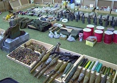 In this image from Syrian TV, showing weapons and explosives seized by Syrian anti-terror forces are displayed after a gunbattle with radical Muslim militants in the northern city of Idlib 330 km (200 miles), north the Damascus on Thursday, Dec.8, 2005.