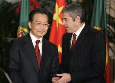 China's Prime Minister Wen Jiabao, left, listens to his Portuguese counterpart Jose Socrates Friday, Dec. 9 2005, before a joint news conference at the Queluz palace outside Lisbon.