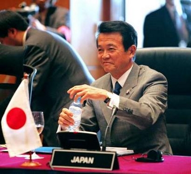 Japan's Foreign Minister Taro Aso smiles before the start of the ASEAN + Japan foreign ministers meeting at Kuala Lumpur Convention Center, ahead of next week's 11th ASEAN Summit and the inaugural of the East Asia Summit, in Kuala Lumpur December 9, 2005.