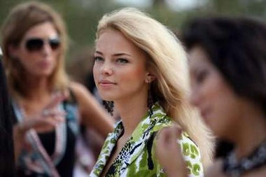 Miss Moldova Irina Dolovova poses during a tree planting event at the Beauty Crown Centre in downtown Sanya on China's Hainan island December 9, 2005.