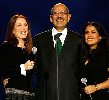 Nobel Peace Prize laureate Mohamed ElBaradei is surrounded by actresses Julianne Moore (L) and Salma Hayek (R) during the 2005 Nobel Peace Prize Concert in Oslo December 11, 2005. U.N. nuclear watchdog International Atomic Energy Agency (IAEA) and its leader Mohamed ElBaradei won the 2005 Nobel Peace Prize for their efforts to limit the spread of atomic weapons.