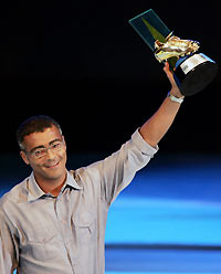 Romario kisses the trophy after receiving the award for the player who scored the most number of goals at the Brazilian championship, at the Joao Caetano theatre in Rio de Janeiro December 5, 2005.