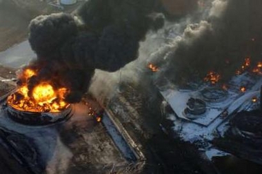 A police handout photograph released on December 13, 2005 shows firemen directing foam onto burning fires at the Buncefield fuel depot in Hemel Hempstead near London on December 12, 2005.