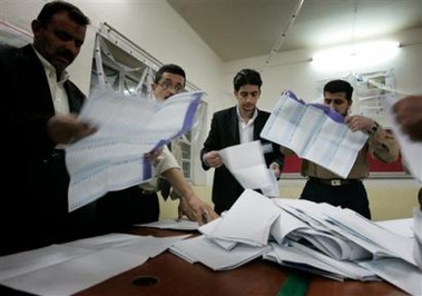 Iraqi election officials count the votes at an election center in Baghdad, Iraq Thursday, Dec. 15, 2005.