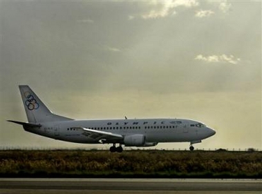 The boeing 737-300 of Greek Olympic ariways is seen before taking off from Cyprus to re-enact the course of a Cypriot airliner that crashed near Athens on Aug. 14, killing all 121 people on board, in Larnaca international airport in southern Cyprus 45 kilometers (28 miles) from the capital of Nicosia on Monday, Dec. 19, 2005.