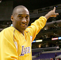 Kobe Bryant points to the crowd after he scored 62 points, a personal record and a Staples Center record, against the Dallas Mavericks in NBA action in Los Angeles, December 20, 2005.