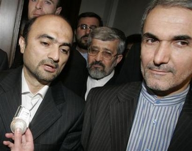Iran's head of delegation to the International Atomic Energy Agency (IAEA) Reza Vaidi (L) briefs the media next to Iran's Permanent Representative to the U.N. Mohammad Mehdi Akhondzadeh Basti after talks with representatives of France, Great Britain, Germany and the European Union in Vienna December 21, 2005.