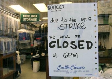 An early closing notice due to the transit strike is seen posted on the window at Carlton Cleaners on New York's upper eastside Thursday, Dec. 22, 2005. Store manager Ron Sales said business at the store, which is located down the block from a New York City subway station, was down by about 30% since the start of the transit strike. (AP