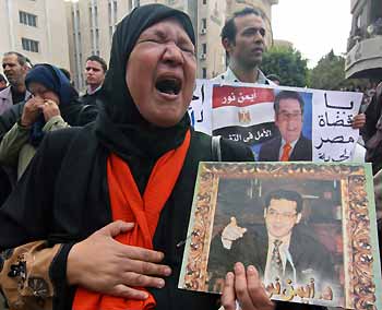Opposition politician Ayman Nour supporters cry in despair outside a court in Cairo December 24, 2005.
