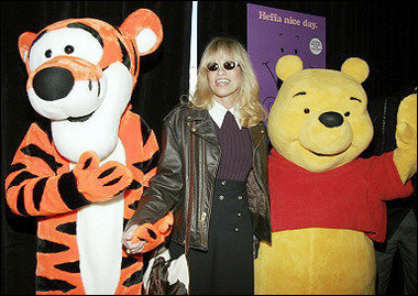 Singer/songwriter Carly Simon poses for a photo with Tigger and Winnie the Pooh before the premiere of 'Pooh's Heffalump Adventure' at Loew's theater in New York City, in February 2005.