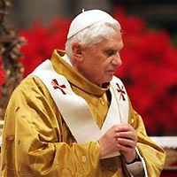 Pope Benedict XVI arrives to lead the midnight mass in Saint Peter's Basilica at the Vatican, December 25, 2005.