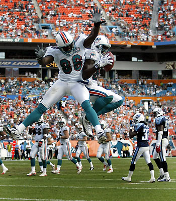 iami Dolphins receivers Marty Booker (L) and Chris Chambers celebrate a touchdown catch by Chambers against the Tennessee Titans in Miami, Florida December 24, 2005. 