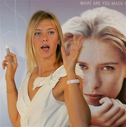 AP - Sat Dec 24, 1:19 AM ET Russian tennis star Maria Sharapova waves to photographers after signing her autograph on her poster during a press conference to promote a Swiss brand sports watches in Tokyo Saturday, Dec. 24, 2005.