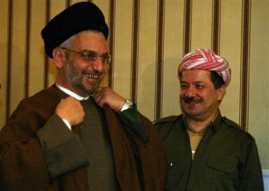 United Iraqi Alliance leader Abdul Aziz al-Hakim, foreground and Massoud Barzani, president of the Kurdish region, are seen during a press conference at the council of Ministers in Irbil, Iraq, Tuesday, Dec. 27. 2005.
