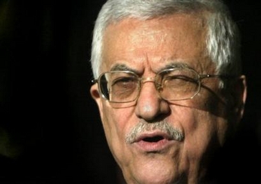 Palestinian President Mahmoud Abbas, also known as Abu Mazen, speaks to reporters outside his office in Gaza City, Wednesday, Dec. 28, 2005. The Palestinian leader praised the Fatah Party's decision to unify and urged all Palestinians to come together.