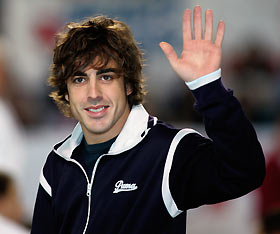 world champion Fernando Alonso of Spain waves during a charity event in Oviedo, northern Spain December 24, 2005. McLaren stunned Formula One last Monday by announcing that world champion Alonso will leave Renault to race for them in 2007