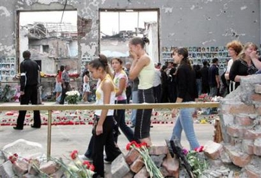 Relatives of the Beslan school siege victims grieve in the gym of Beslan School No.1, September 2, 2005.