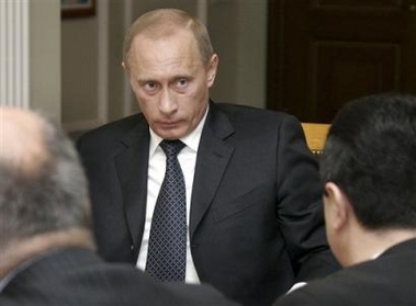 Russian President Vladimir Putin, center, meets with Head of the Ukrainian national state gas company Naftogas Alexei Ivchenko, right, and Ukrainian Energy Minister Ivan Plachkov, left, in the Novo-Ogaryovo residence outside Moscow, Thursday, Dec. 29, 2005.