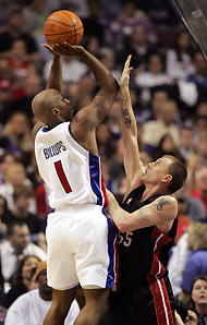 Detroit Pistons guard Chauncey Billups (1) shoots over Miami Heat guard Jason Williams during the fourth quarter of their NBA game at the Palace in Auburn Hills, Michigan December 29, 2005.