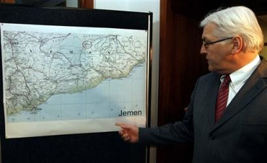 German Foreign Minister Frank-Walter Steinmeier answers journalists' questions on the kidnapping of former German Foreign Ministery's top official Juergen Chrobog in Yemen as he stands in front of a map of Yemen prior to a meeting of the crisis committee in Berlin Thursday, Dec. 29, 2005.