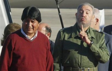Cuban President Fidel Castro gestures as he accompanies Bolivia's President-elect Evo Morales before they listen National Anthems at the Jose Marti International Airport in Havana,Cuba, Friday,Dec.30,2005.