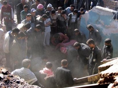 Iraqis search for the bodies of victims of an alleged U.S. airstrike in Beiji, 250 kilometers (155 miles) north of Baghdad, Iraq, Tuesday Jan. 3, 2005.