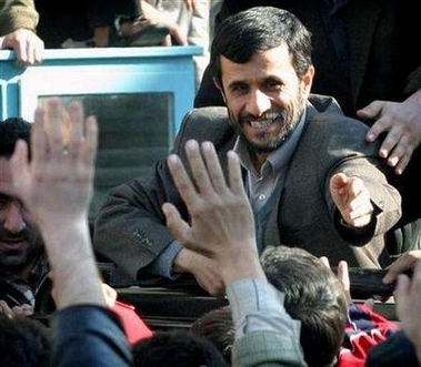 Iranian President Mahmoud Ahmadinejad waves to supporters during his weekly trips, in the city of Qom, 125 km (77 miles) south of Tehran January 5, 2006.