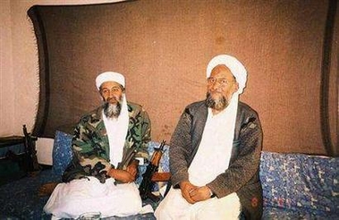 Osama bin Laden sits with al Qaeda deputy leader Ayman al-Zawahri (R) during an interview, November 10, 2001.